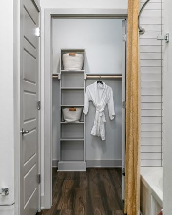 Expansive walk-in closets with custom shelving*